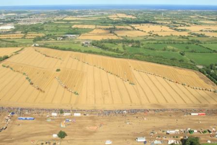 Aerial photo of the Combines4Charity event in 2009. This photo shows 175 combines working at the same time in a field at Platin, near Duleek to gain entry to the Guinness World Book of Records. Combines4Charity was established in 2009 in a bid to set a new world record for having the most combine harvesters working simultaneously in the same field. This record was achieved on 15 August 2009 with 175 combine harvesters working alongside each other. The Irish record was broken by a group of Canadian farmers in 2010 who had 200 combines working. On Saturday, 28 July 2012, a new world record was achieved at Platin when 208 combines worked side by side cutting a crop of winter barley. The photo also gives an excellent bird’s eye view of east Meath from Duleek to the coast. (Photo by Brian Meegan - supplied via Combines4Charity Group)