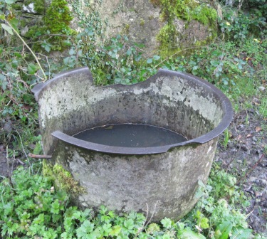 Iron cauldron in old farmyard near Rathkenny. These iron cauldrons are still to be found in fields and farmyards all around the County. Some of them may date from famine times (photo by Joan Mullen)